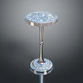 Elegant Metallic Side Table With Intricate Carved Top And Decorative Base