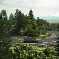 Curved Road Infrastructure With Street Lamps Trees And Black Car In Natural Surroundings
