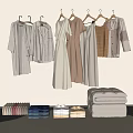 Hanging Clothes In Neutral Tones With Folded Items In Minimalist Interior