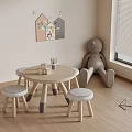 Children's Room Round Wooden Table Set With Padded Stools And Decorative Wall Art