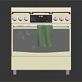 Beige Gas Range Oven With Multiple Burners Control Knobs And Green Towel