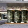 Modern Entrance Gate with High Rise Buildings Palm Trees Lighting and Paved Ground