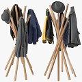 Wooden Tripod Coat Racks With Hanging Yellow Blue And Gray Garments