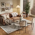 Brown Leather Sofa With Throw Pillows Glass Coffee Table Rattan Chairs And Potted Plant Decorative Paintings