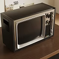 Vintage Black Television on Wooden Table with Classic Retro Design