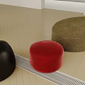 Brown Red Black Round Stools in Bright Room with Light Wood Floor and White Curtains