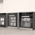 Three Sleek Modern Kitchen Appliances In Black Silver With Glass Doors Showing Dishes Inside