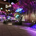 Enchanting Evening Space With Purple Lit Trees Colorful Lanterns And Architectural Structures