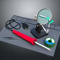 Essential Craft Tools With Magnifying Glass Tweezers Soldering Iron Green Thread Spool On Grey Mat