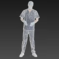 Man In Blue Surgical Scrubs With Gloves And Patterned Cap Standing On Grey Background