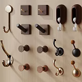 Various Decorative Wall Hooks With Diverse Shapes And Materials On Wooden Background