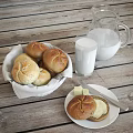 Fresh Homemade Bread Rolls With Milk And Butter On Wooden Table