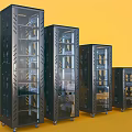 Four Black Computer Server Racks With Transparent Doors Internal Equipment And Wheels On Yellow Background