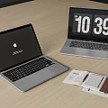 Two Laptops On Wooden Desk With Apple Logo Digital Clock And Notebook Pen