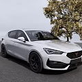 White Sporty Hatchback Car Parked On Gray Asphalt With Black Rims Near Yellow Leaf Tree