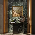 Luxurious Console Table with Green Marble Wall Gold Framed Painting Black Countertop Sculpture and Books