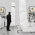 Modern Exhibition Interior With Multiple Display Stands And Labeled Exhibits 3d model