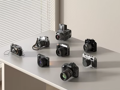Multiple Digital Cameras With Various Models And Colors Displayed On Table By Window Blinds 3d model