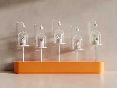 Shop Window Display Featuring Five Glass Cloches on White Stands with Orange Base 3d model