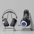 Modern Gaming Headphones with Blue LED Light on Transparent Stand and Built-in Mic