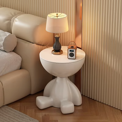 White Round Side Table with Distinctive Legs Next to Beige Sofa Holding Lamp and Radio 3d model