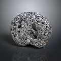 Porous Natural Stone With Irregular Shape And Speckled Gray Surface Holes