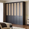 Modern Dark Gray Wardrobe with Rattan Paneled Doors and Gold Handles in Bedroom Interior