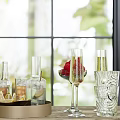 Drinks on Tray with Glasses Bottles Champagne Cups Red Fruits and Window Background