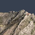 Scenic Mountain Landscape with Rocks Green Vegetation Red Roofed Building and Path Near Waterfront