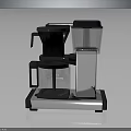 Modern Coffee Maker Machine With Transparent Water Tank Black Silver Base Contemporary Kitchen Appliance Design