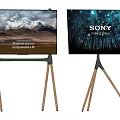 Two TVs on Wooden Tripod Stands Showing Snowy Mountain and Sony 8K HDR Screens