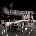 Luxurious Banquet Hall With Elegant Ceiling Decor Central Runway And Floral Arrangements
