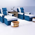 Two Blue And White Massage Beds With Small Table Decorative Wooden Buckets On White Background
