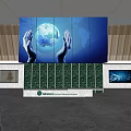 Modern Front Desk Reception Area With Earth Graphic Hands Large Screen And Green Plant Wall