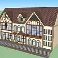 Tudor Style Office Building With Brown Roof Large Windows Arched Doors And Balcony
