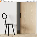 Black Dining Chair With Round Backrest Three Legs Near Light Wood Grain Door And White Wall
