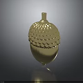 Shiny Golden Acorn Decorative Object With Scaled Texture And Reflective Base