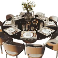 Elegant Dining Table Set With Round Black Tabletop Beige Chairs Flower Vase And Golden Decor