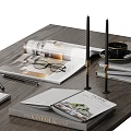 Elegant Decorative Ornament Set With Open Magazines Eyeglasses Golden Figurine And Notebooks On Wooden Tabletop