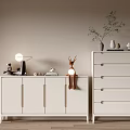 Light Colored Entryway Cabinet And Sideboard With Deer Figurine Table Lamp And Potted Plant