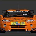 Orange Sports Race Car With Rear Wing Number 57 And Sponsor Decals