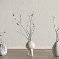 Stylish Ceramic Vases With Decorative Twigs On Wooden Floor Against Textured Wall