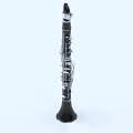 Black Clarinet Musical Instrument With Silver Keys Upright On Light Background