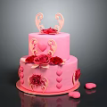 Two Tier Pink Cake with Red Roses and Heart Decorations on Top