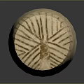 Cylindrical Carved Sculpture With Intricate Facial Features And Decorative Lines On Dark Background