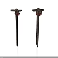 Two Ancient Weapons Made Of Rusted Iron Nails With Red Decorations On Top