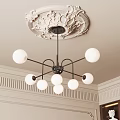 Elegant Chandelier With White Spherical Lampshades And Black Metal Frame On Decorative Ceiling Medallion