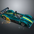 Green And Yellow Single Seat Racing Car With Streamlined Body And Rear Wing