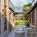 Traditional Chinese Boutique Guesthouse Architecture With Brick Walls Wooden Frames Lattice Windows And Courtyard Stone Basins