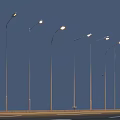Illuminated Outdoor Street Lights Arranged In A Row Under Blue Sky